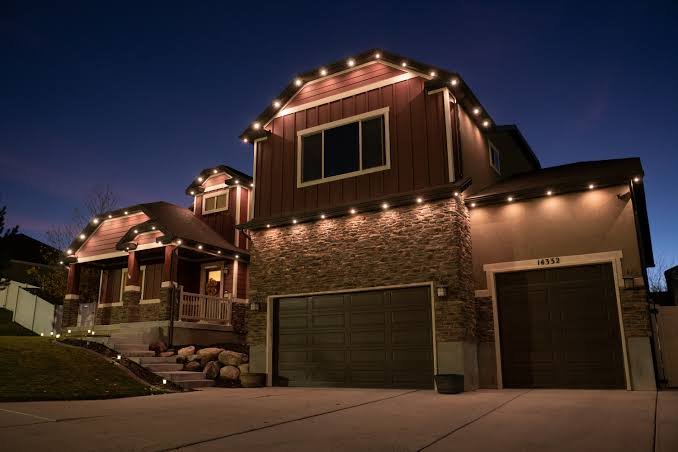 Permanent architectural lighting installed on a home at night